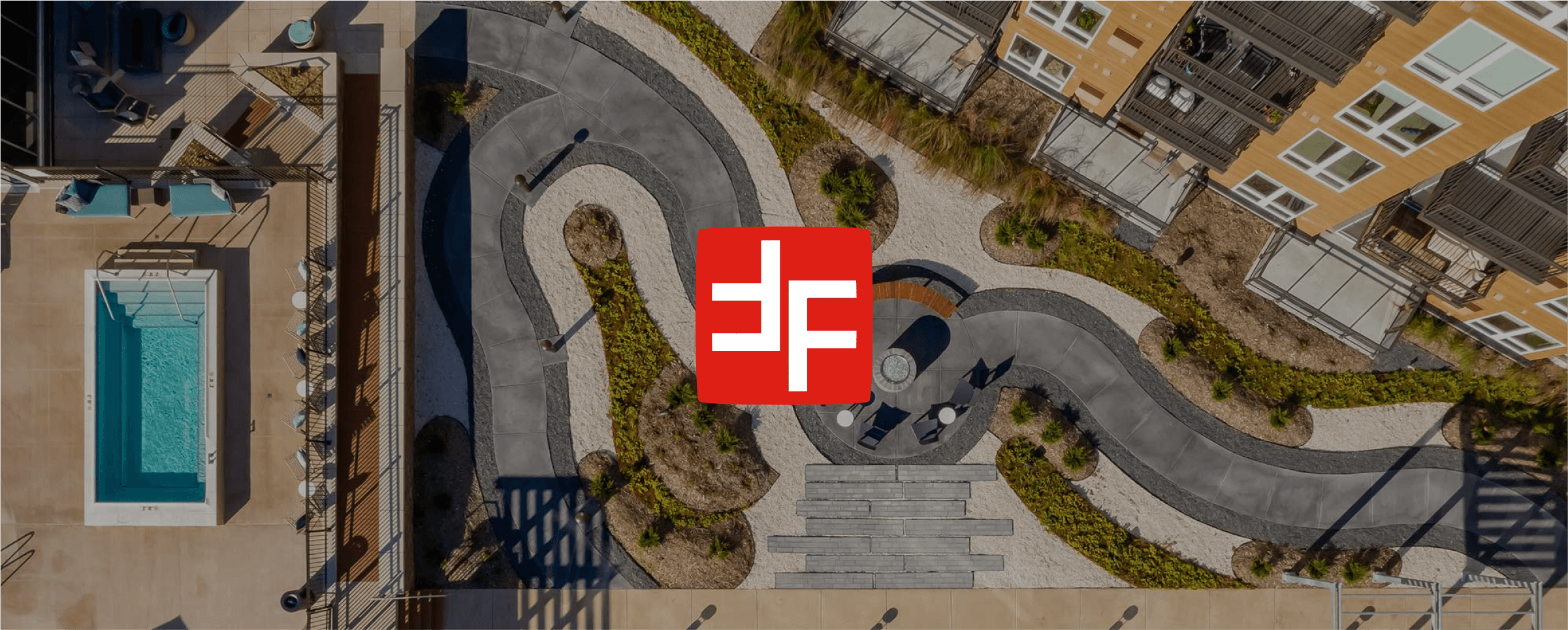 ForumRE logo on top of a shot of one of their projects